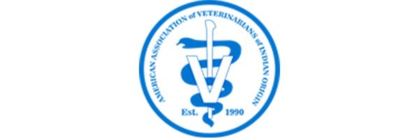 A blue and white logo with a rod of Asclepius intertwined with the letter V, surrounded by text and established in 1990.