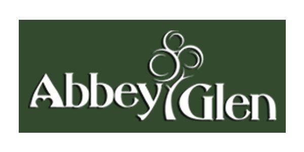 Abbey Glen logo with stylized tree design on a dark green background.